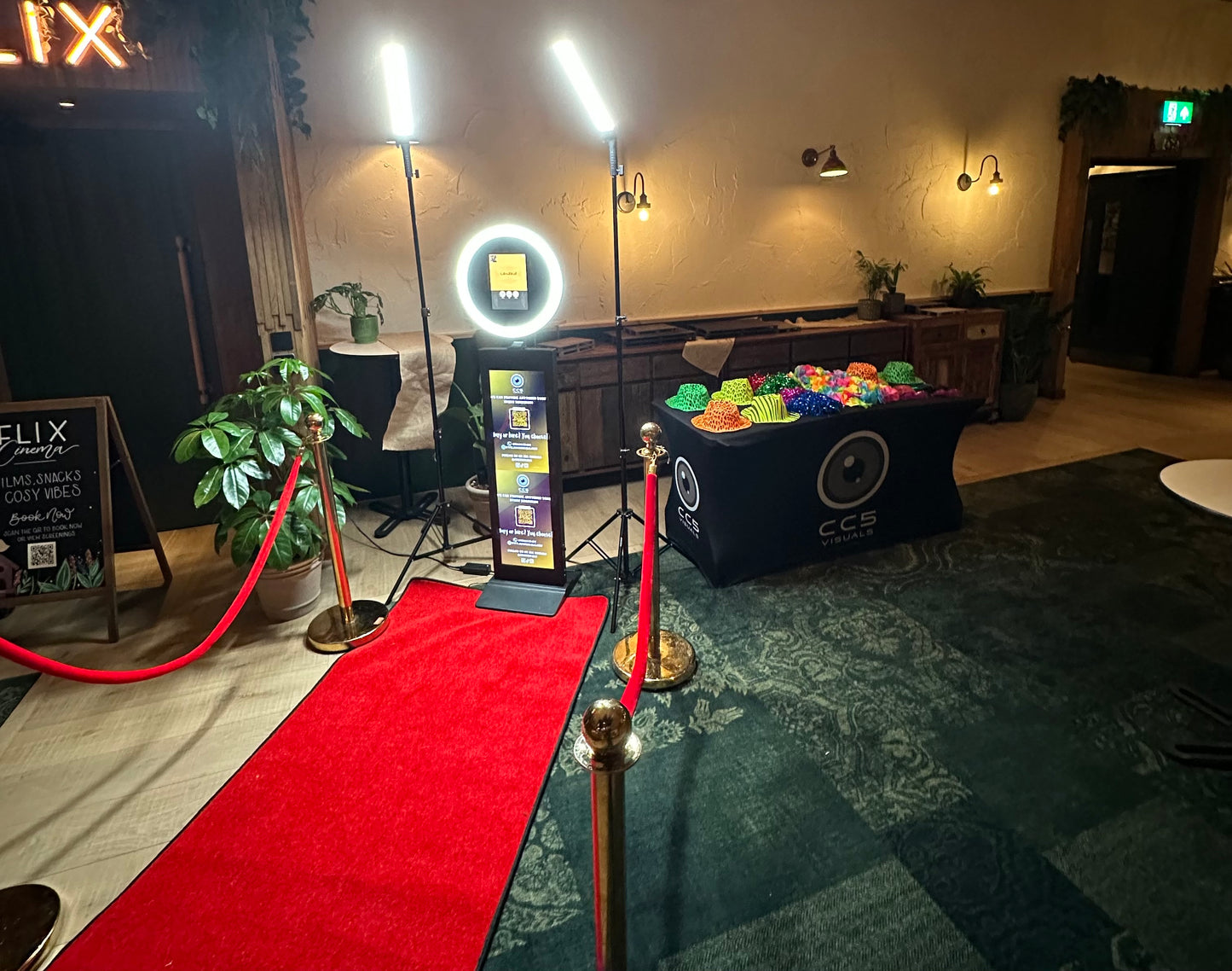 Event setup with red carpet, branded CC5 Visuals props table and Ipad DSLR selfie pod