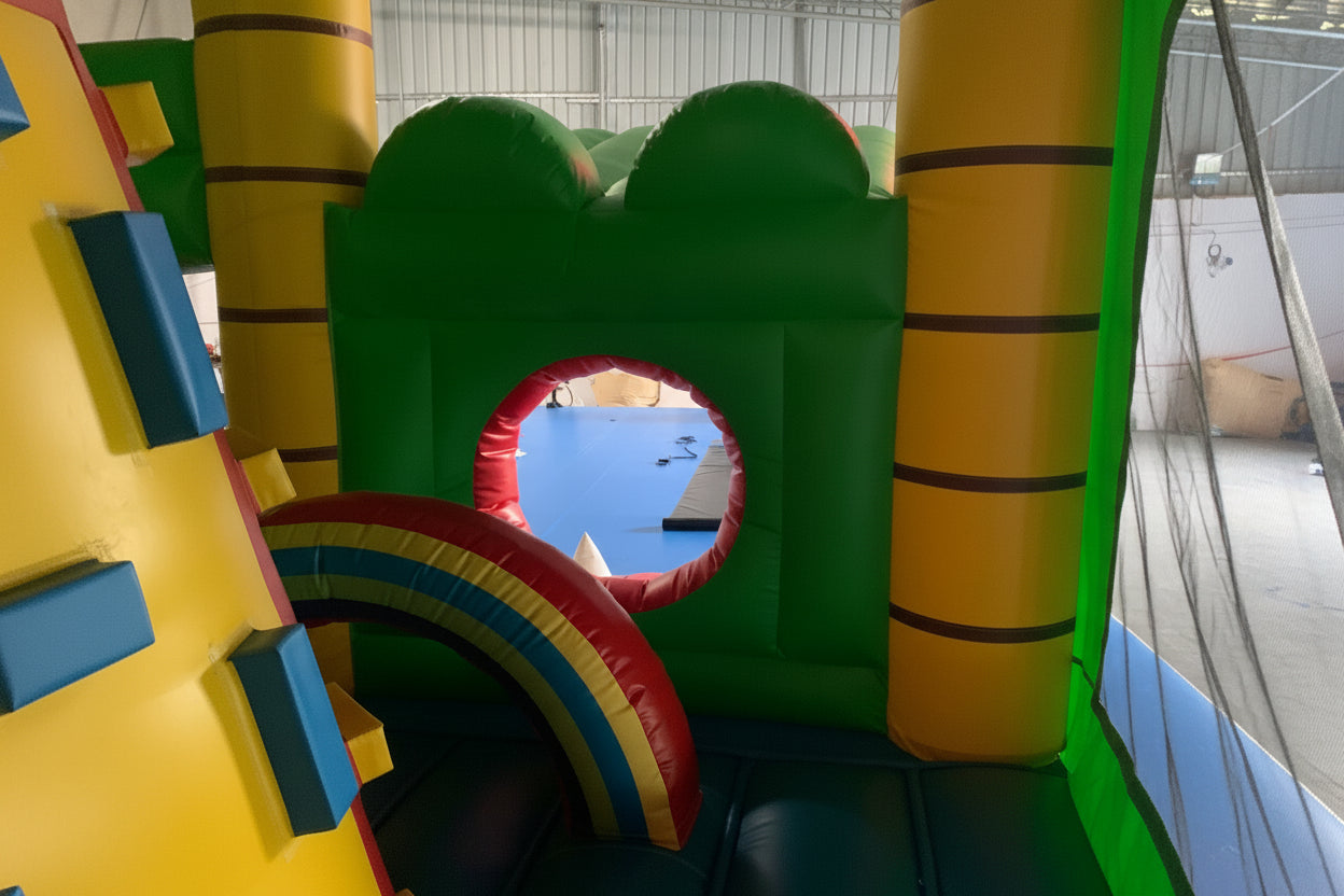 Colourful inflatable bounce house, reptile themed in an indoor setting