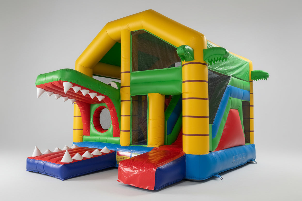 Colorful inflatable playground structure with reptile design on a white background