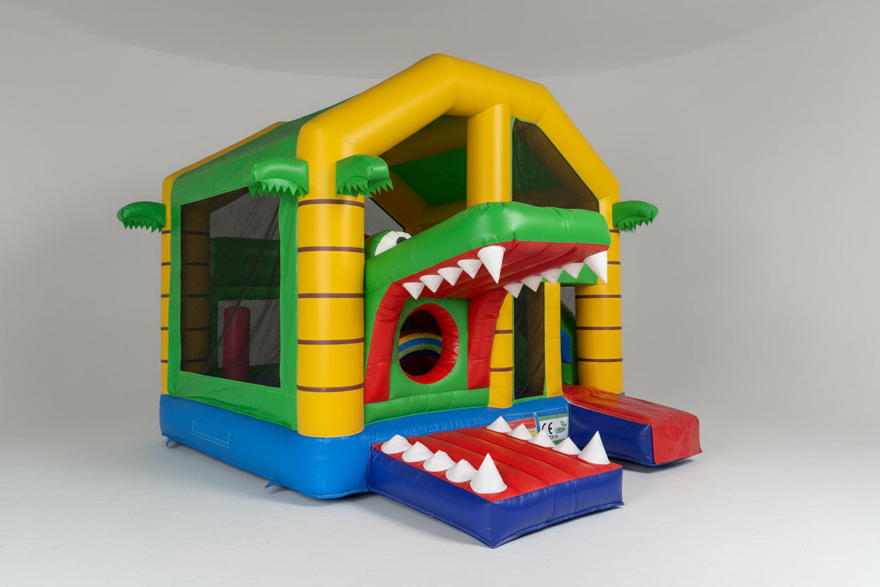 Colorful inflatable playground structure with a reptile design in an indoor setting.