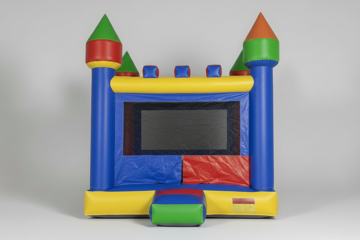 Colorful inflatable bounce house with towers on a plain background