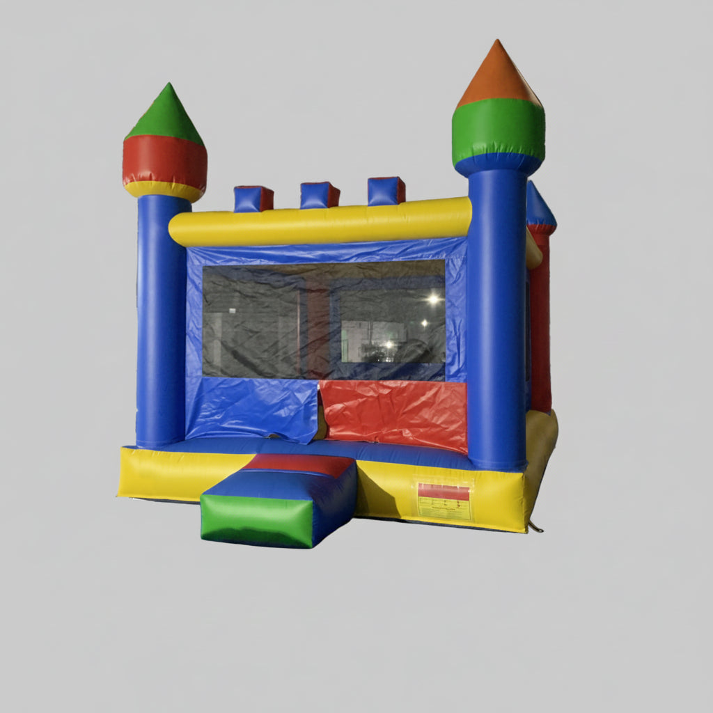 Colorful inflatable bounce house with castle design on a gray background