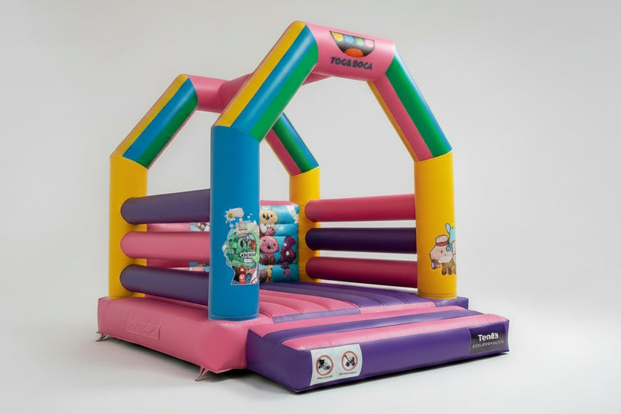 Colorful inflatable play structure with cartoon characters on a white background