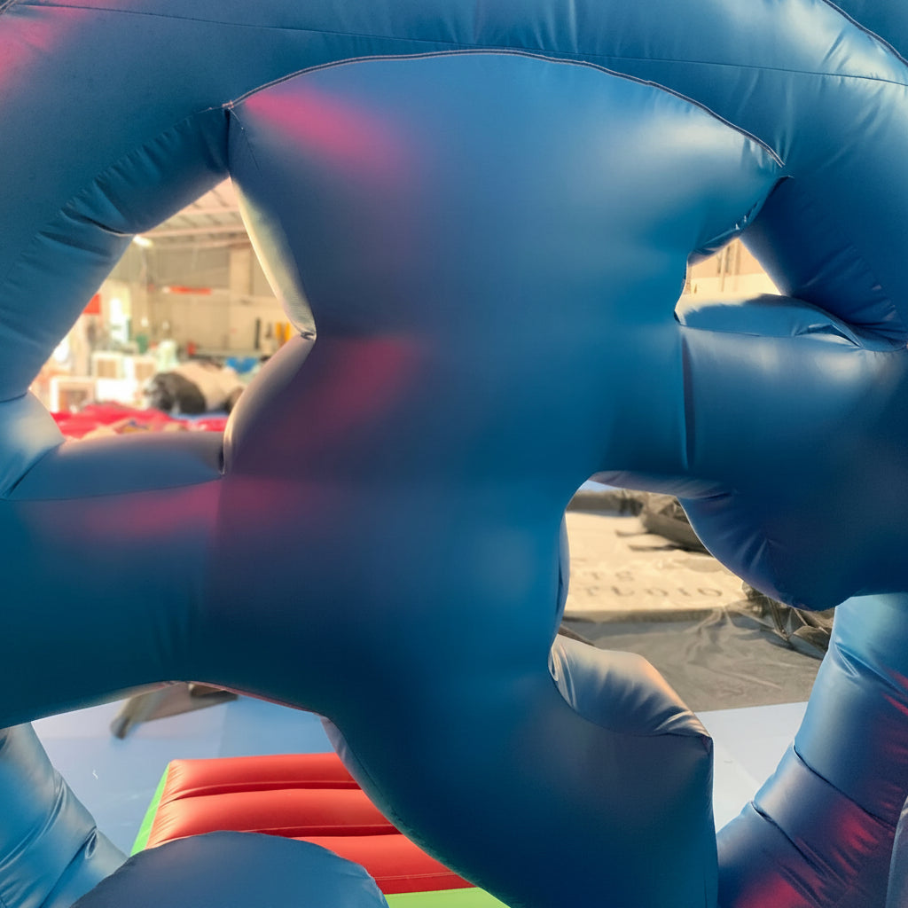 Close-up of a super mario blue inflatable house with a blurred background