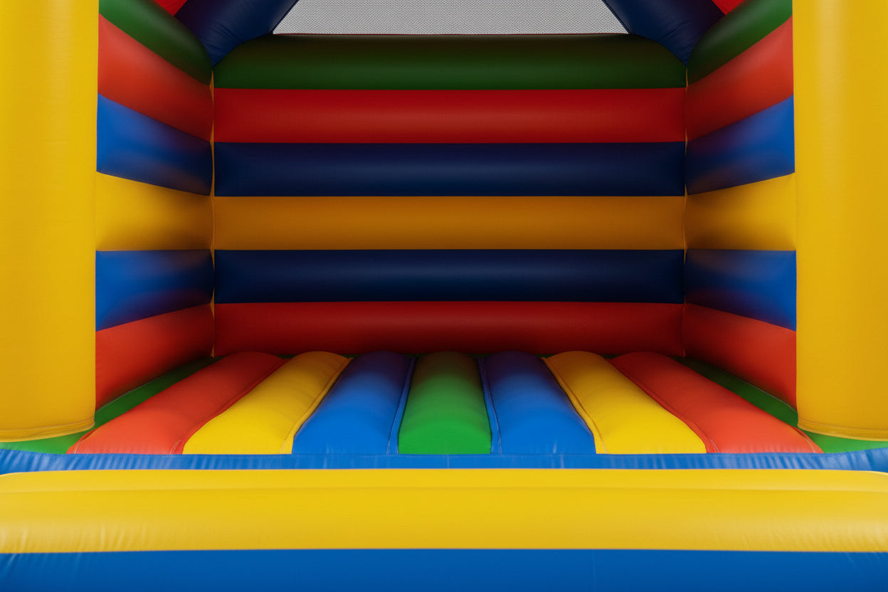 Colorful inflatable bounce house with red, blue, green, yellow, and orange panels.