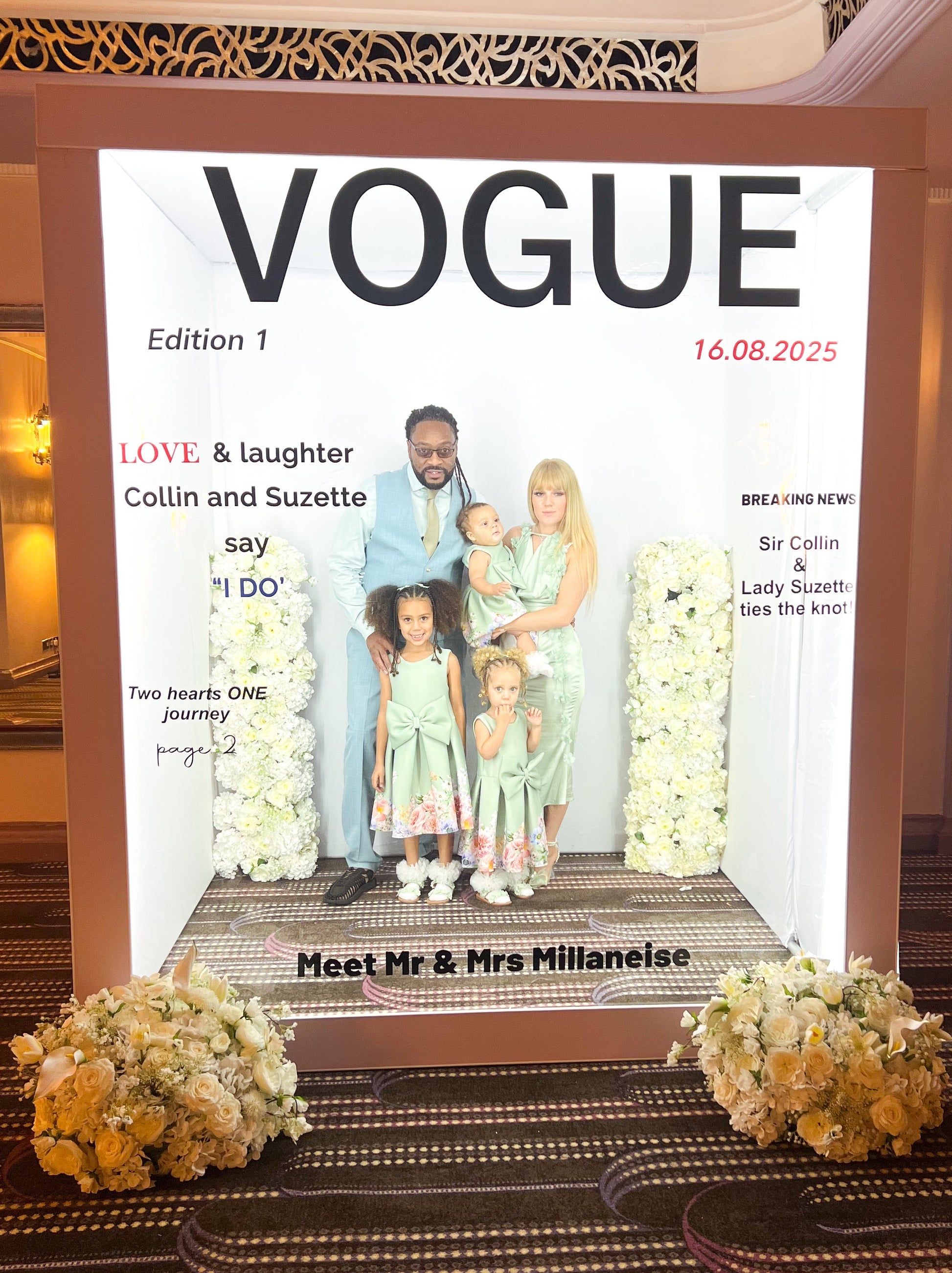 Vogue magazine cover with a family on a decorative stand in an indoor setting