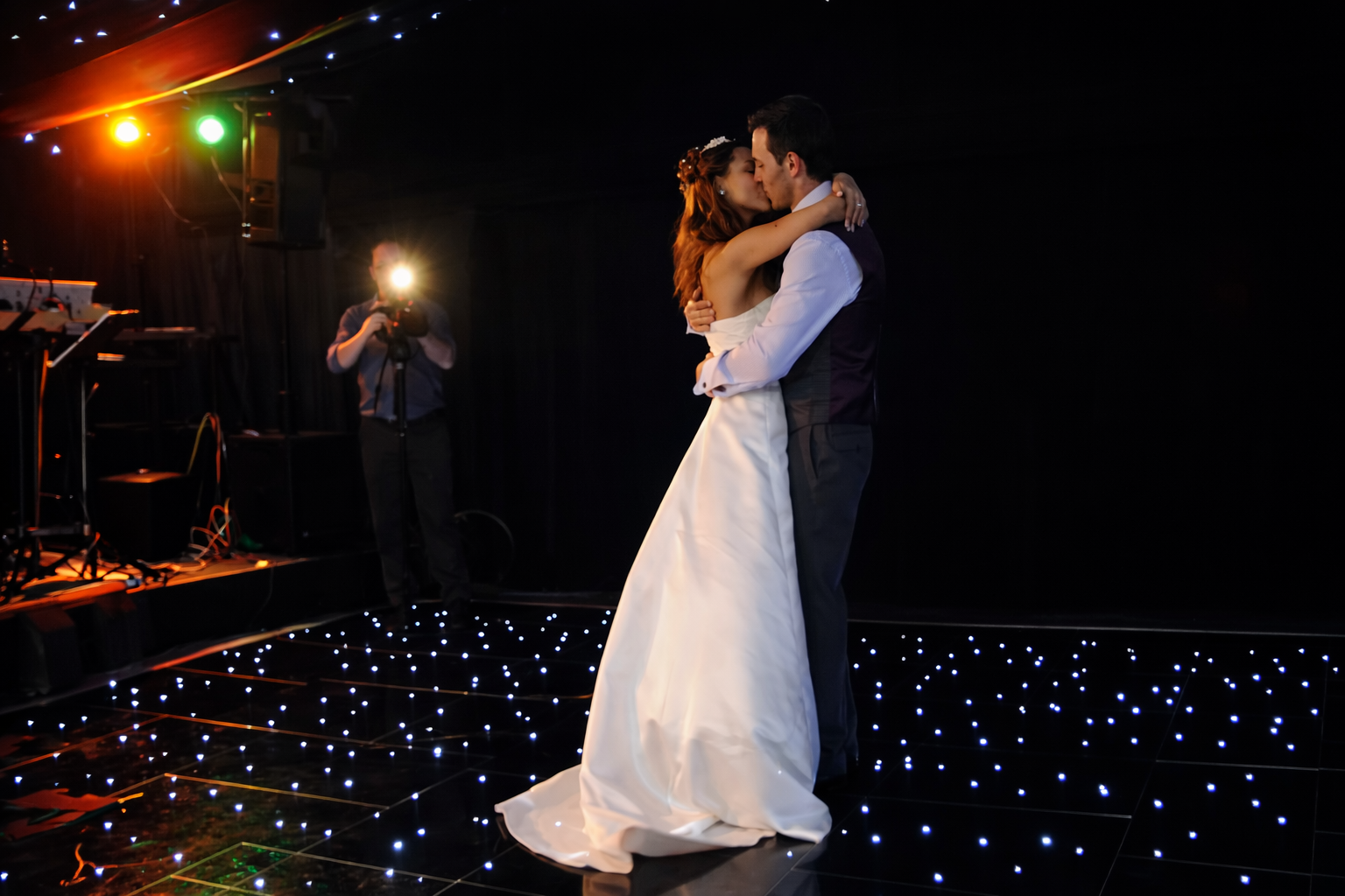 Black Starlit LED Dance Floor with wedding couple kissing