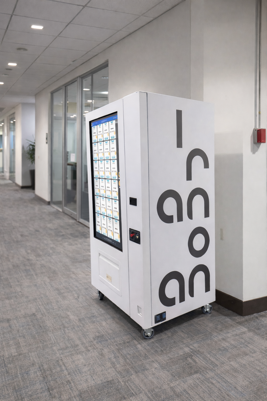 Vending machine with 'Iconano' branding in an office setting