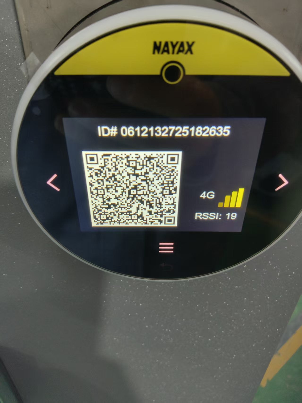 Nayax device with QR code and ID number on a screen
