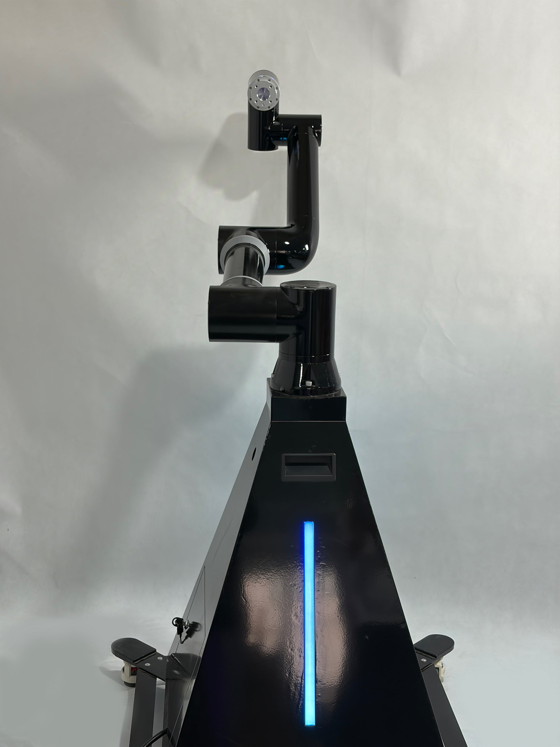 A black robotic arm photobooth with a colorful light stripe, designed for capturing images at events such as weddings and parties.