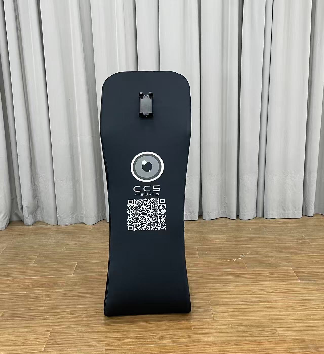 A black customisable tablet sharing station with CC5 Visuals logo on the side and a tablet mounted on top