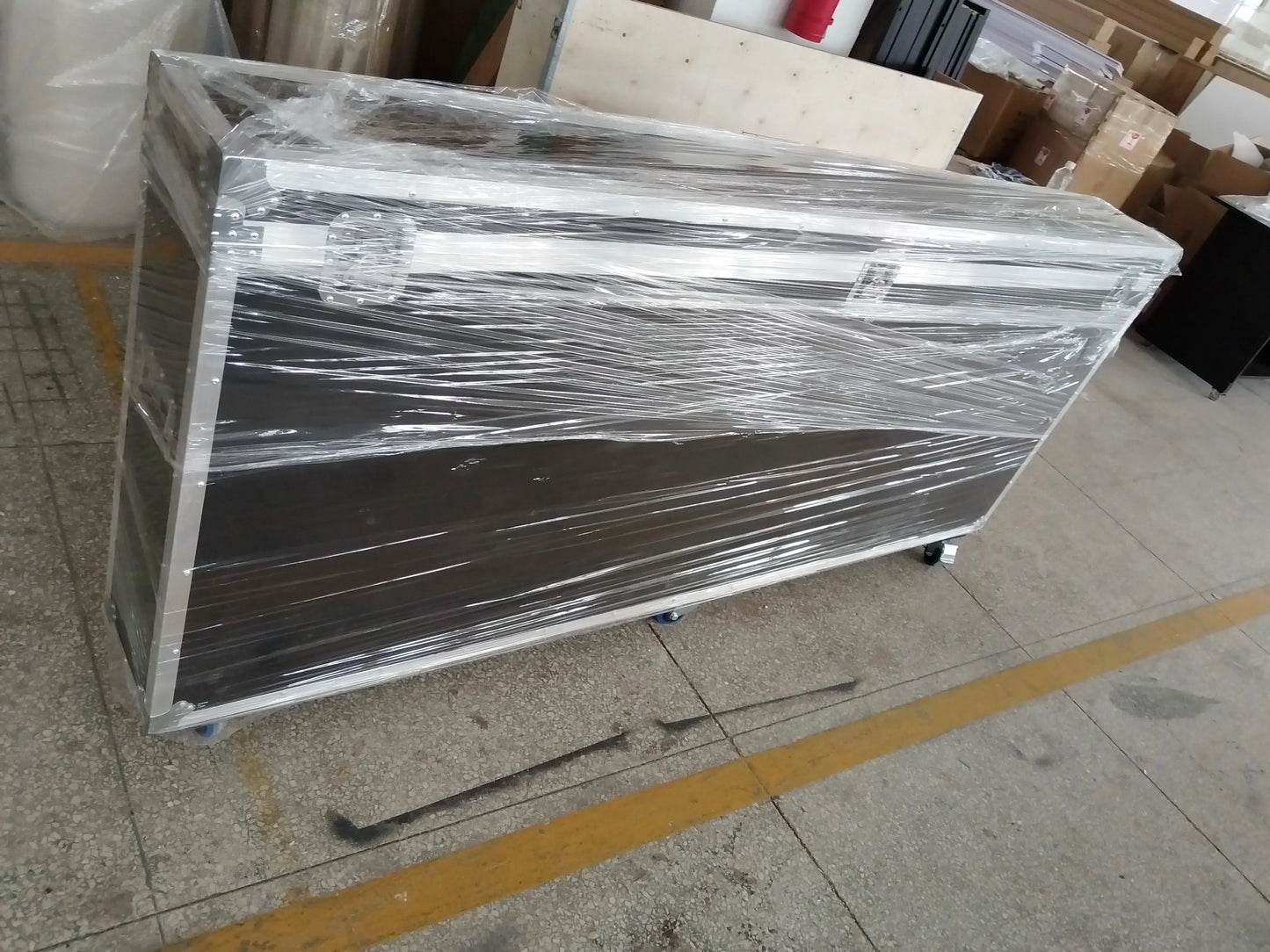 Vogue photobooth wrapped in plastic on a tiled floor