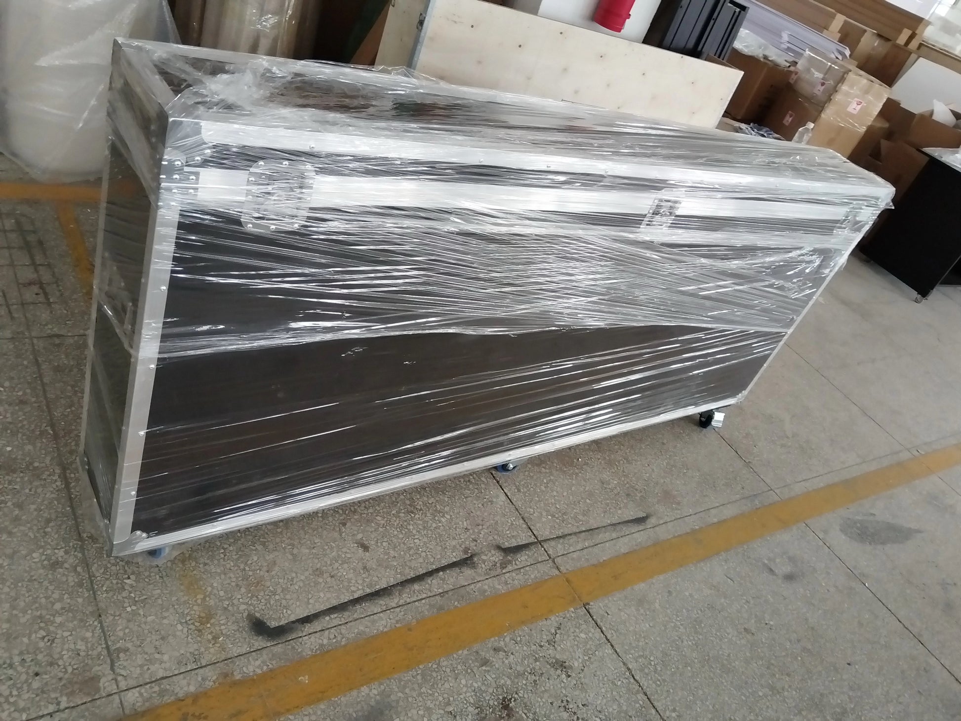 Vogue photobooth wrapped in plastic on a tiled floor