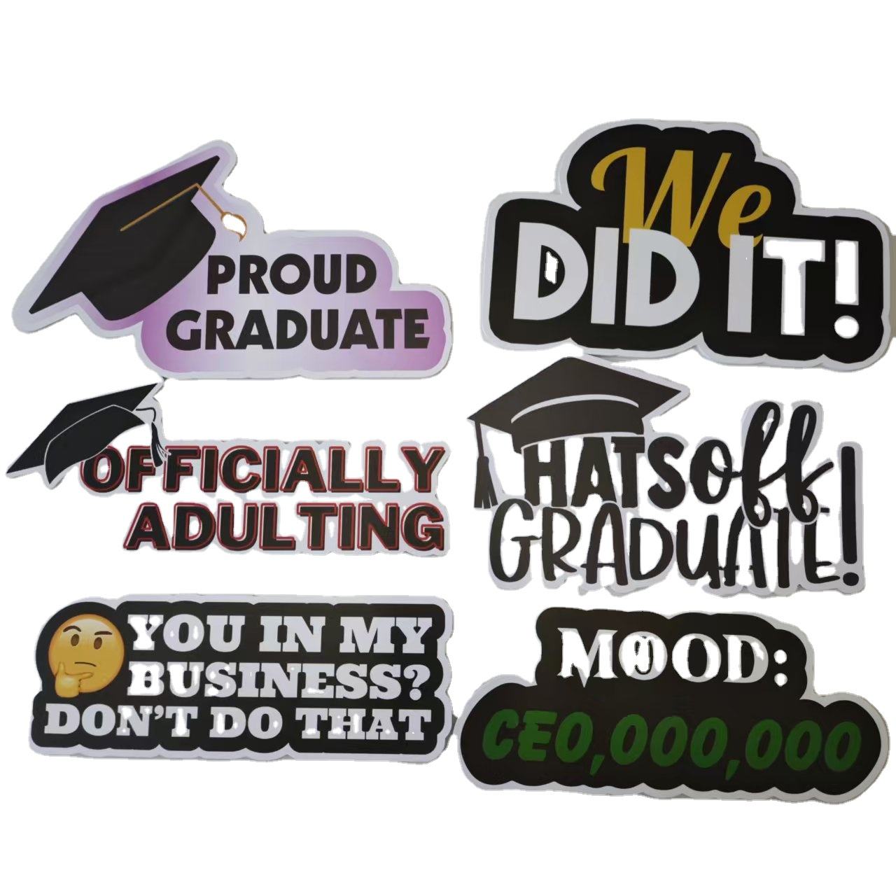Set of humorous graduation-themed photobooth props with text on a white background