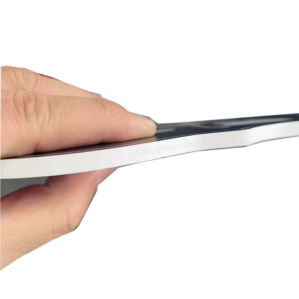 Hand holding a PVC foam photobooth prop with a reflective surface on a white background