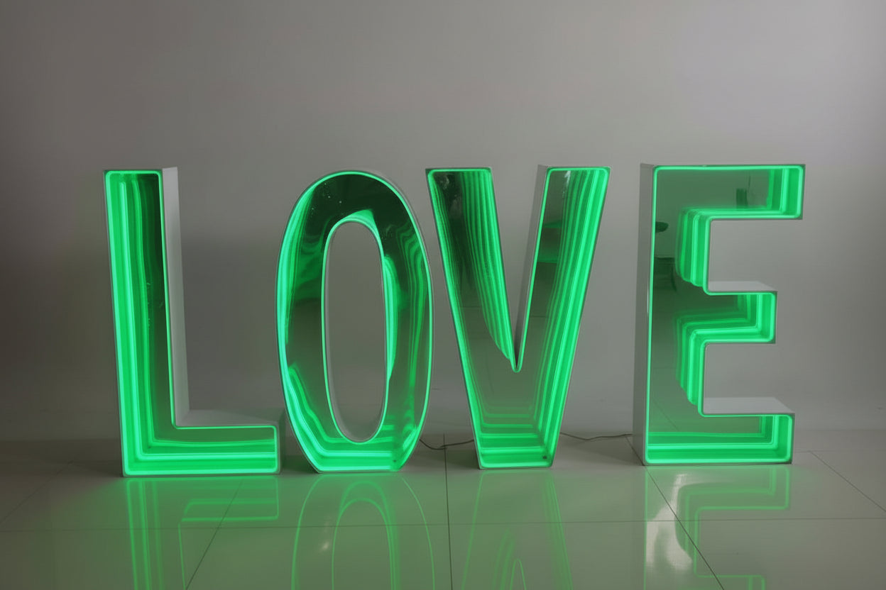 4FT Green neon LED sign spelling 'LOVE' on a reflective surface with a gray background
