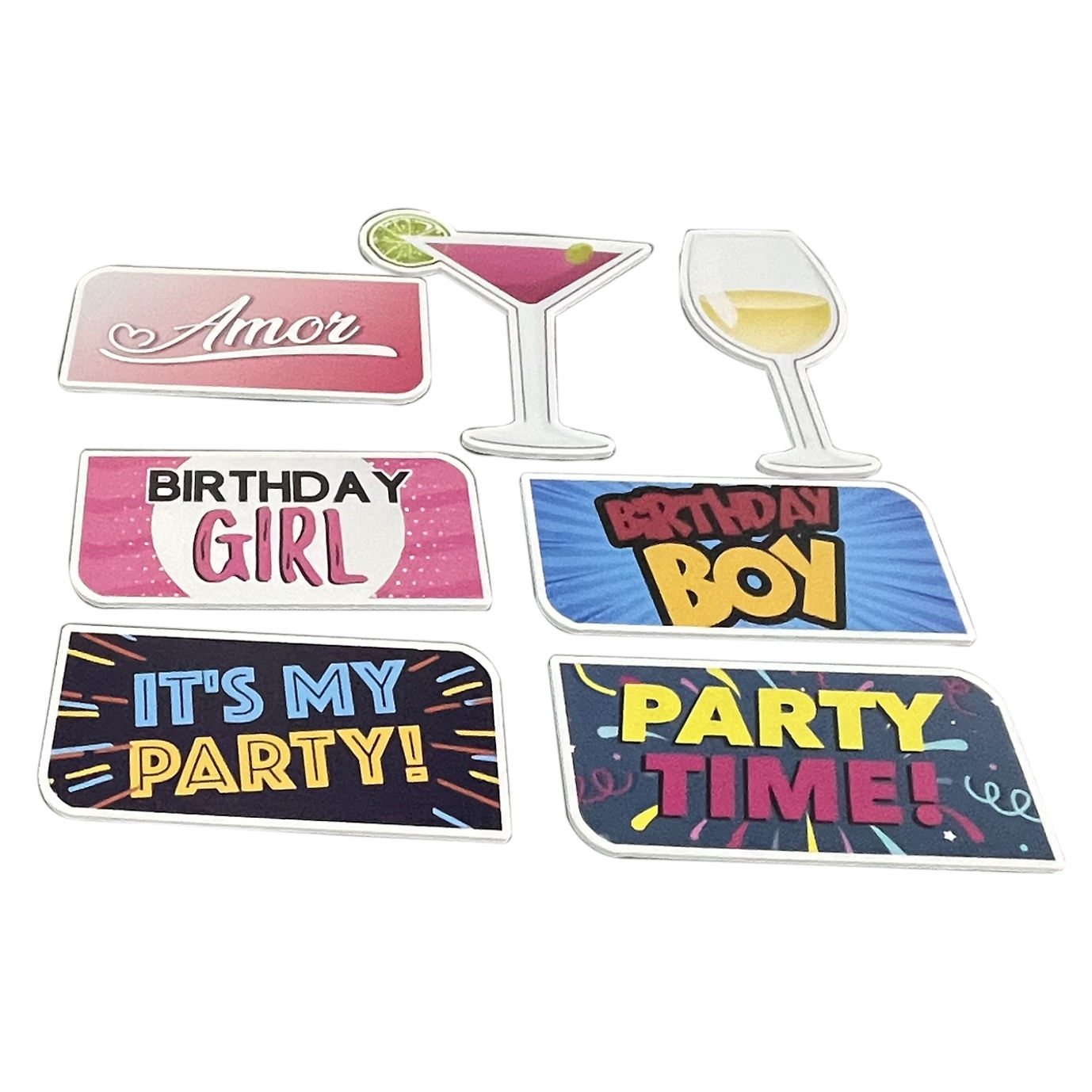 Set of colorful party-themed props on a white background
