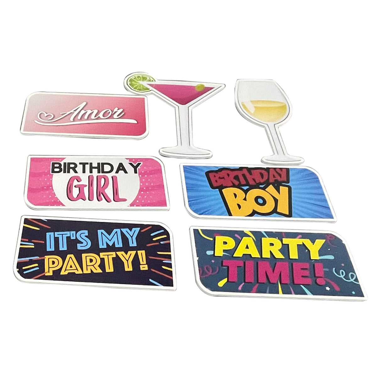 Set of colorful party-themed props on a white background