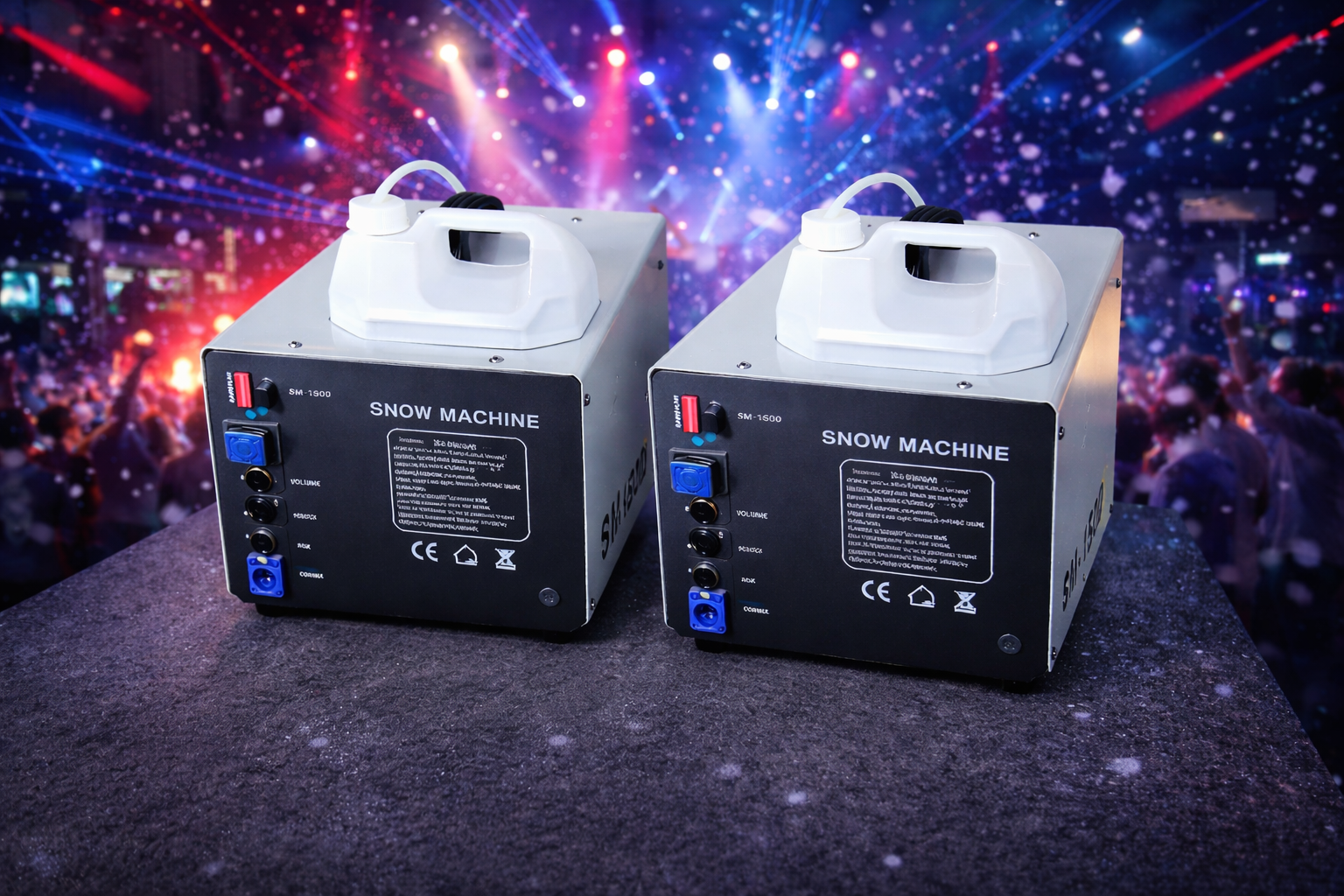 Two artificial snow machine units on a stage with colorful lights in the background