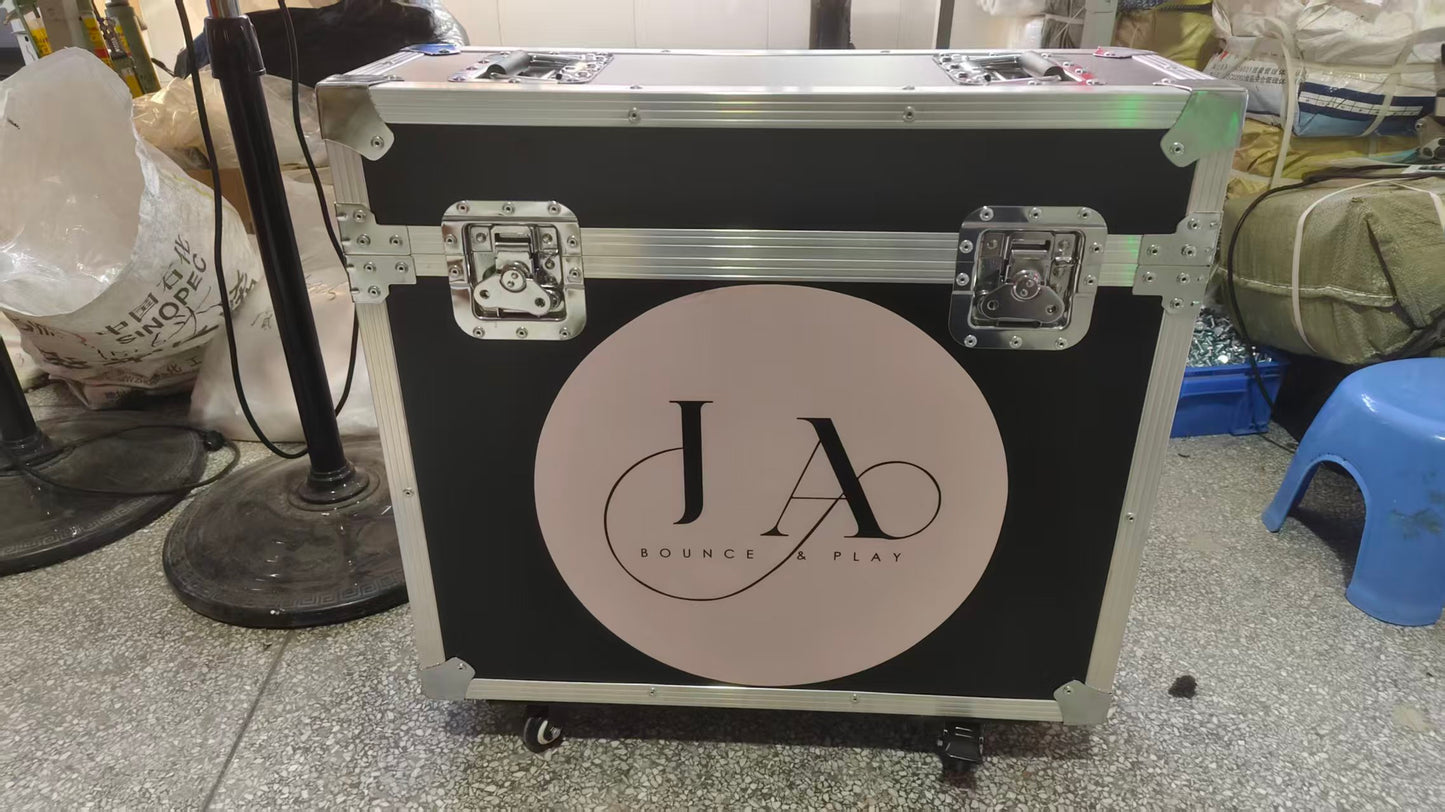 Black travel case with 'JA' logo on a tiled floor