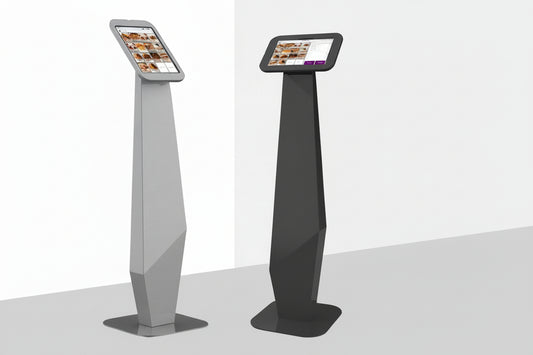 Two tall, slim metal ipad stands in black and gray on a white background.