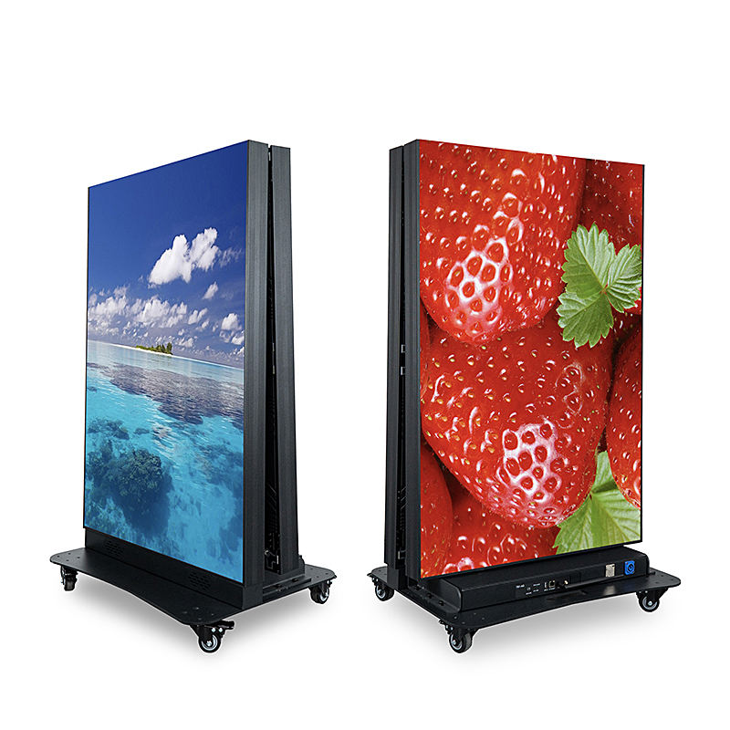 Two folded portable display stands showing a scenic view and a strawberry.