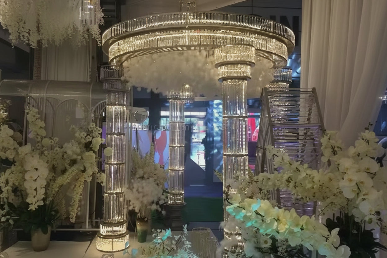 an all gold LED lit mandap in an elegant wedding setting with floral arrangement