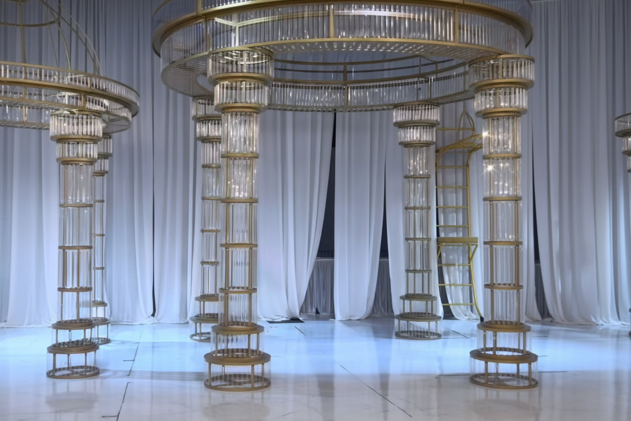 2 sets of all gold mandaps in an elegant wedding setting.