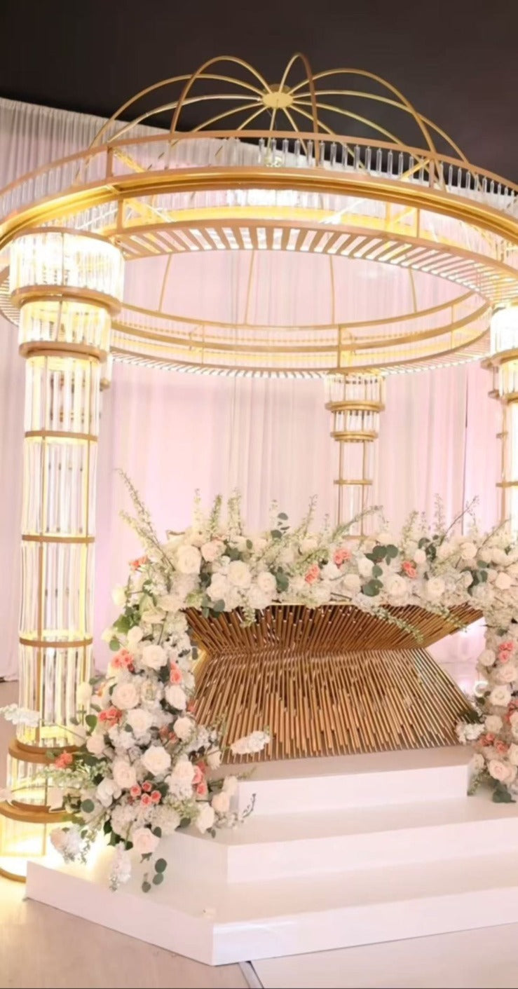 1 piece of all gold mandap in an elegant wedding setting with floral arrangement