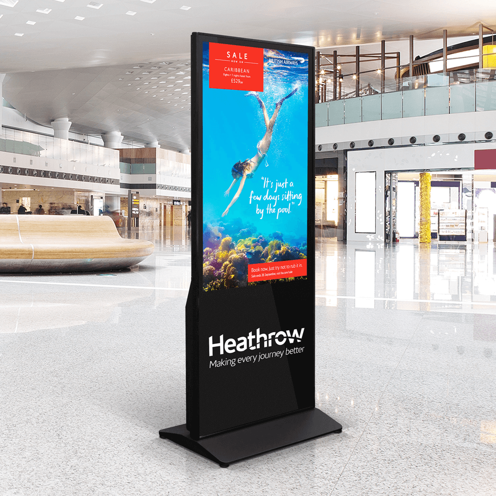 43” LED Touchscreen Indoor Digital Kiosk Floor Stand with Heathrow advertisement in an airport