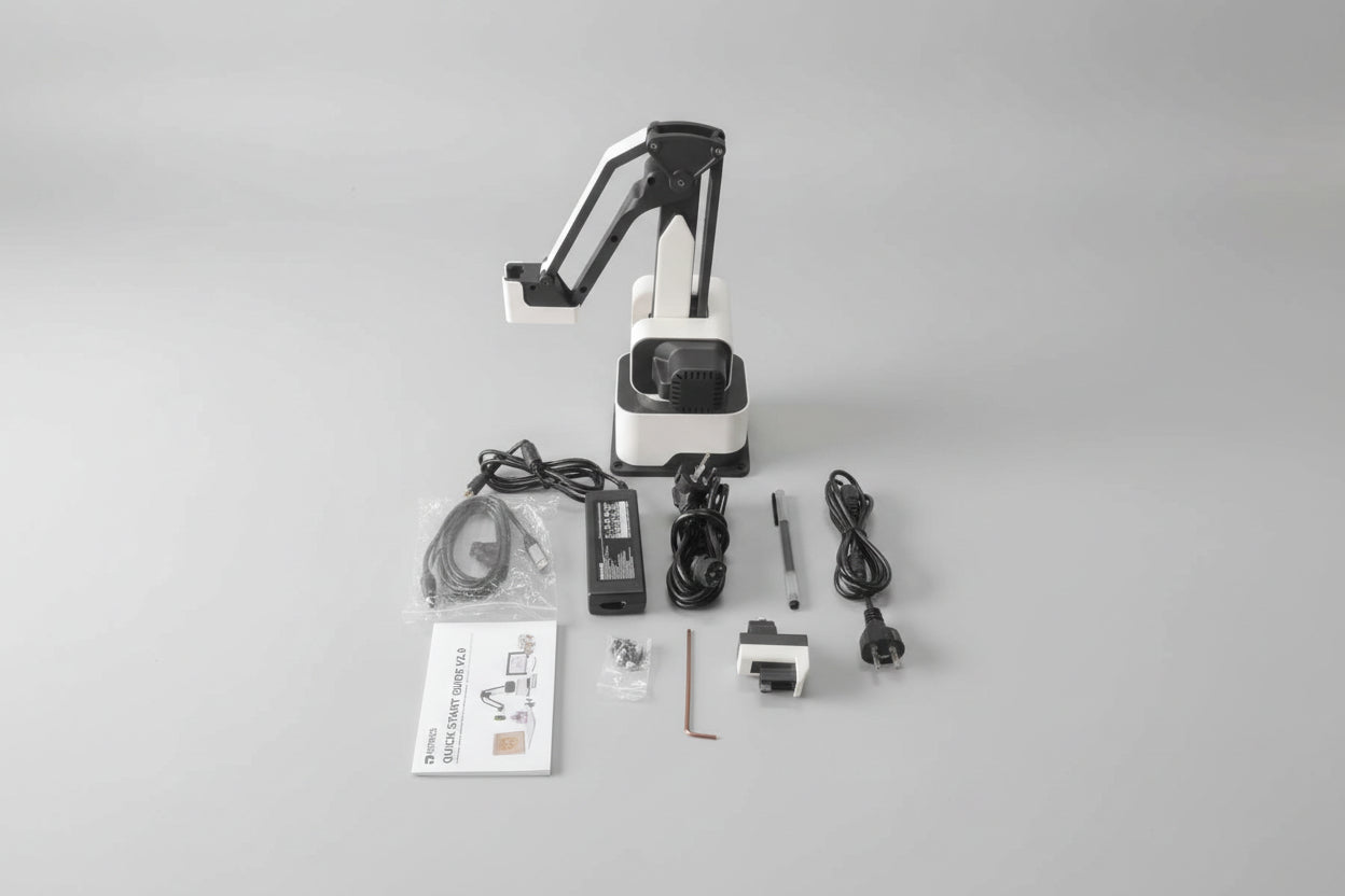 AI robot arm with accessories on a grey surface