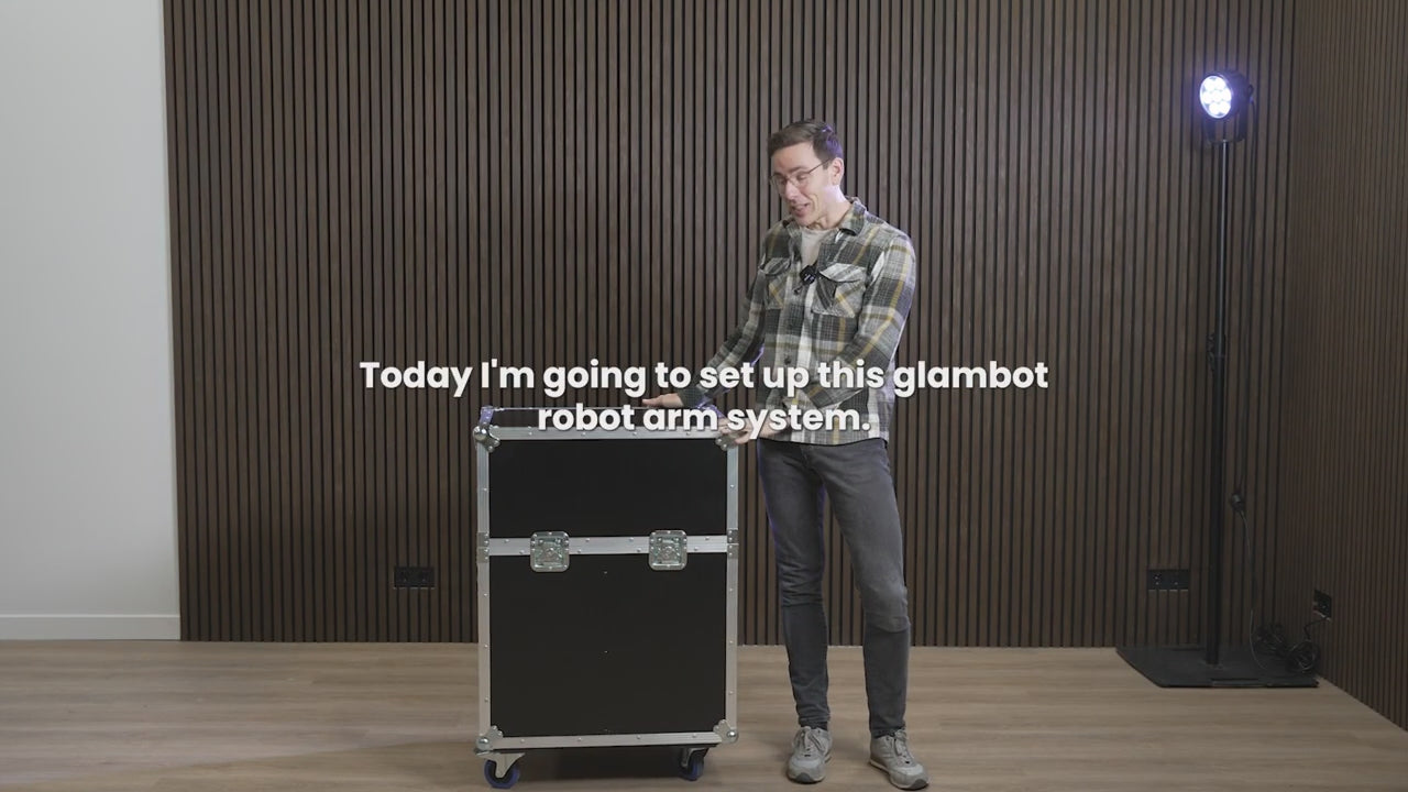 A black Glambot Photobooth Robot Arm mounted on a base with a camera attached to its end.