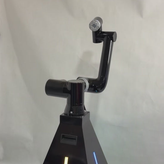 A black robotic arm photobooth with a colorful light stripe, designed for capturing images at events such as weddings and parties.